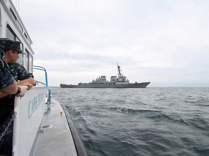 After an hour of heaving seas and whipping saltwater spray, the 505-foot Arleigh Burke-class destroyer came into sight idling off the Virginia seaboard.