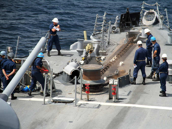 The Captain is waiting for the anchor test to conclude. At several-thousand-pounds, the anchor is attached to the ship by links weighing almost 40 pounds apiece. Here it is being snapped from a free-fall into hundreds of feet of water.