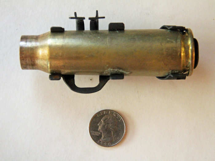 This 20mm casing placed beside a quarter offers an idea of how large the 20mm rounds are.