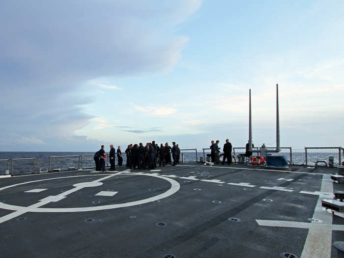 Getting ready for inspection is stressful and so is a combat deployment. Without many places to wind down but out here, sailors meet to grab a smoke at the rear of the ship.