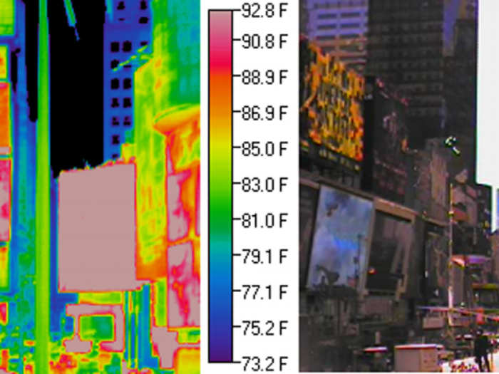 Lights are warmer and therefore emit more longwave thermal radiation than their surroundings, producing the pink or red areas in the above image.