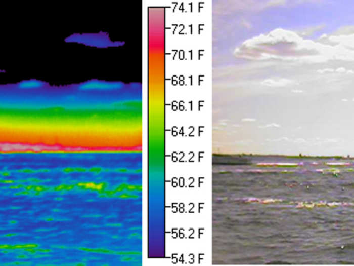 The water remains relatively cool (blue) all day while the Statue of Liberty warms up when exposed to the sun (red). A haze layer exits near the ground, and the particles and droplets in this layer emit “longwave thermal radiation” in the far infrared portion of the spectrum. The haze closest to the ground is relatively warm (red and orange), while the temperature decreases with increasing altitude (yellow to green to blue). The ground is heated both by sunlight and the longwave radiation emitted by the atmosphere. Haze layers over urban areas increase the longwave heating, especially overnight, and promote warmer temperatures.