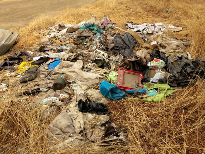 There was trash throughout the area, but in her camp the ground was swept clean.