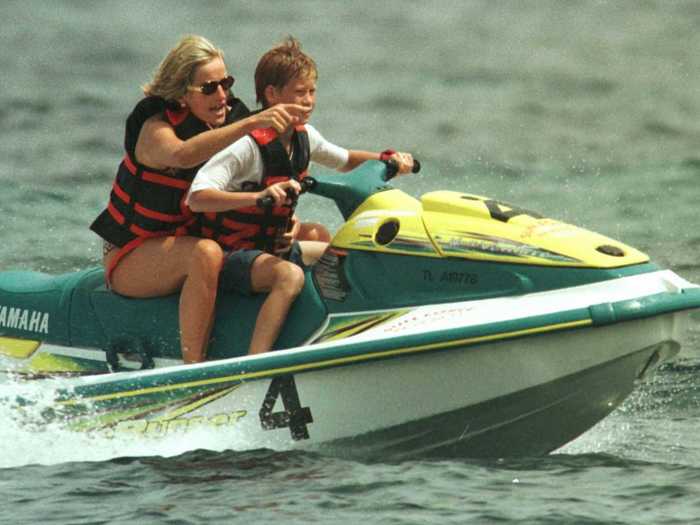 Mother and and son, Harry, jet-ski during a vacation on the French Riviera a month before her death.