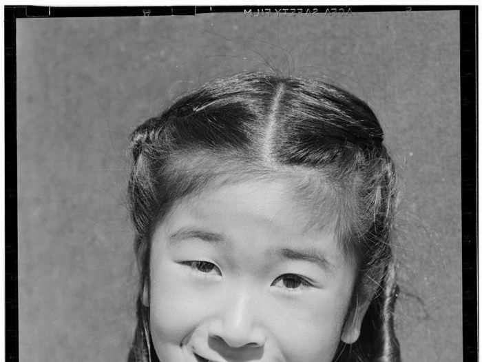 In many instances, Adams took portraits of the people whose daily lives he photographed, like this one of the same little girl, Joyce Yuki Nakamura.