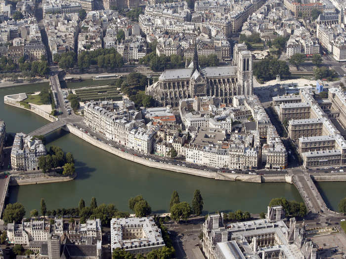 Notre-Dame cathedral sits on pretty Ile de la Cite, surrounded the river Seine.