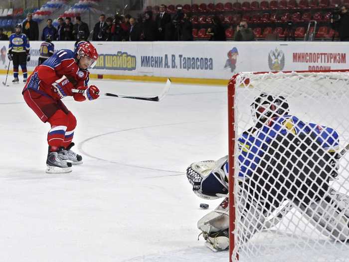 Putin makes a slap shot right before a youth ice hockey tournament. Putin picked up the sport after promising the Russia men