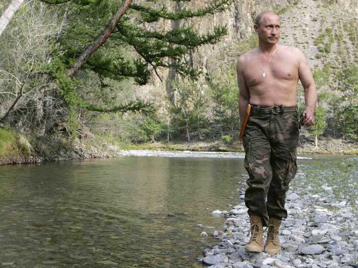 Vladimir Putin again eschews a shirt while hiking along the Siberian Khemchik River in the summer.