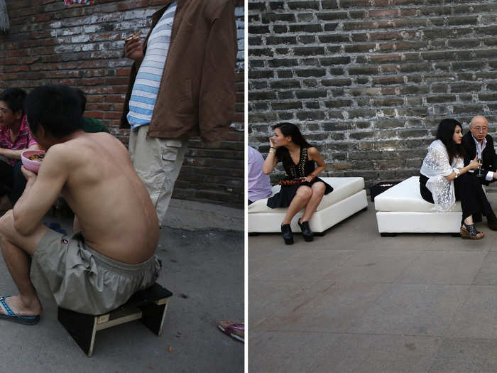 A migrant worker eats dinner as he watches his neighbours gambling in an alley and (R) A bartender holds Champagne glasses at a reception prior to the fashion show.