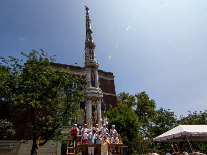 Italian Americans still return in force to the old neighborhood for the festivities, which culminate in the lifting (yes manual lifting) of this huge structure by a large group of large men.