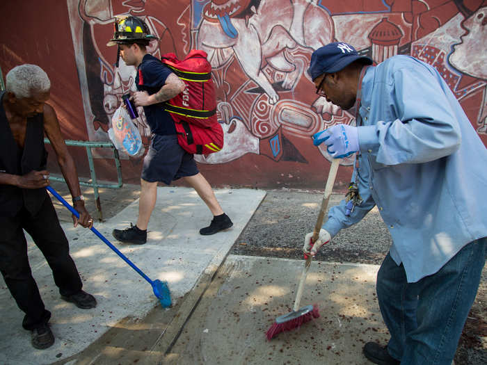 They return to a neighborhood that still has a crime problem. While crime has dropped significantly over the past 20 years, violence remains routine. As a fireman walks to work, building maintenance workers clean blood from the night before.