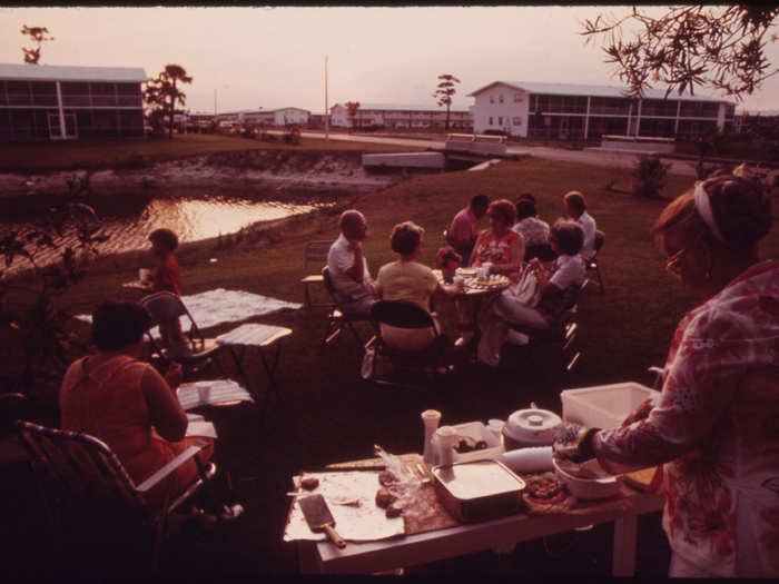 Neighbors at the Century Village Retirement Community Gathered Behind Their Apartments for an Outdoor Supper. All Units in the Complex Were Individually-Owned Condominiums.