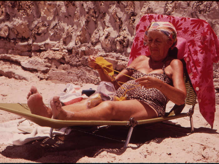 A Member of the South Beach Retirement Community Enjoying the Sun and Sea Air. Most of the Retirees in the Area Live in Inexpensive Residential Hotels Within Walking Distance of the Public Beach. (Miami Beach)