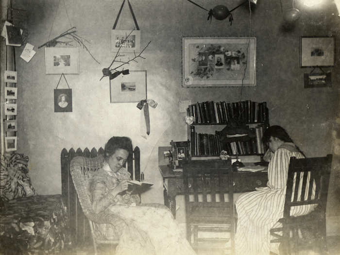 Photographs and mementos kept things homey in this room, in 1899.