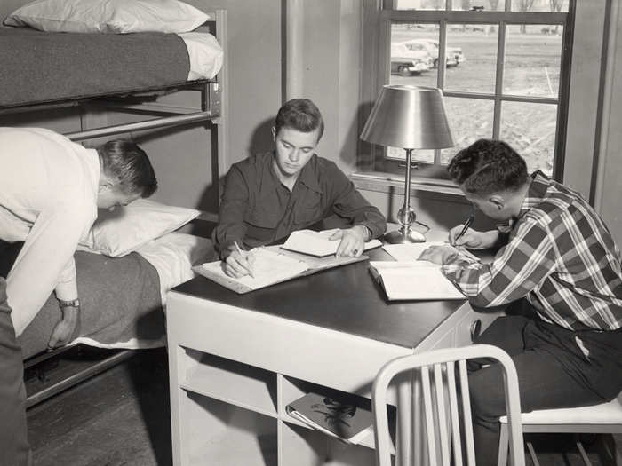 In the 1950s, students studied around a communal table (and did a great job making their beds).