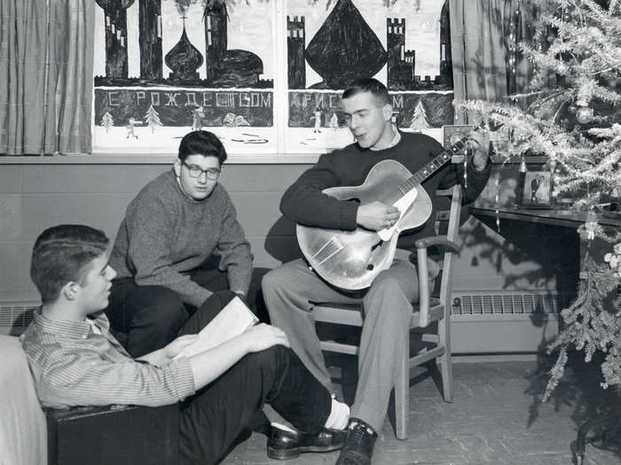 Guitar-playing co-eds are nothing new. Note the Russian mural, which reads "Merry Christmas," in this picture from 1958.