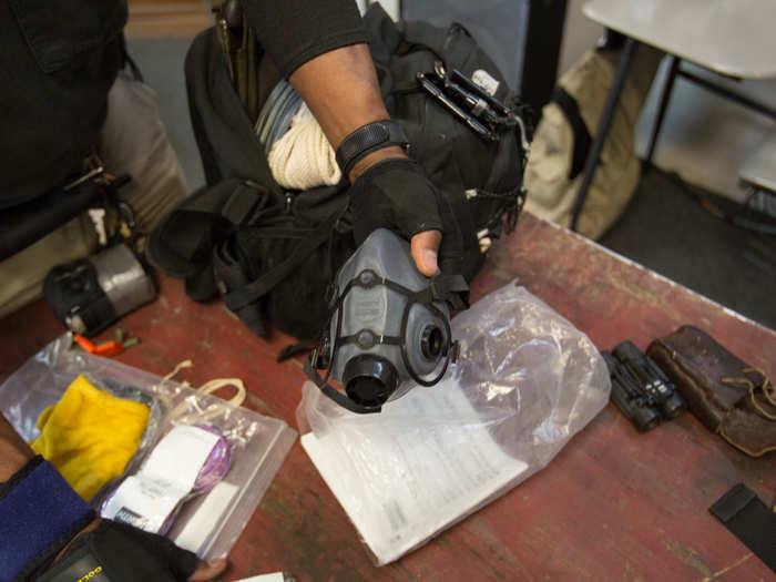 In addition to water storage, both men carry respirators to protect against environmental contamination in New York