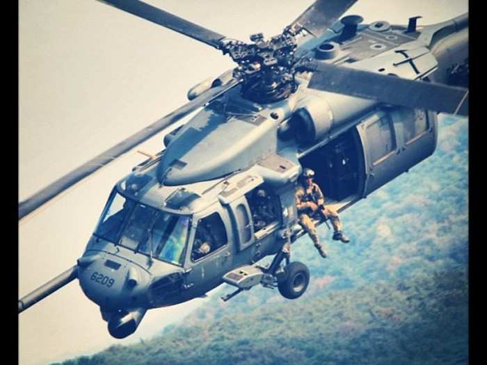 The Air Force is probably the best of all the services when it comes to photography. Here we see an airman just chilling in the door of his bird.