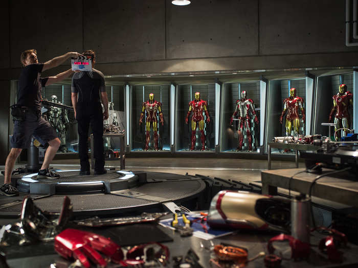 Here he is surrounded by the various incarnations of the "Iron Man" suit.