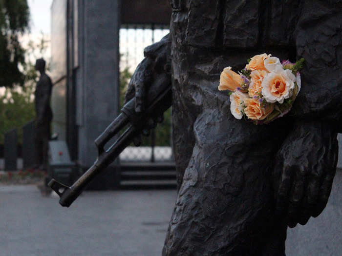 Flowers are left on the monuments to celebrate a decade of peace in Transnistria.