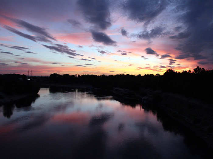 The colorful skies of Transnistria reflected in the slow-moving water of the River Dniester.