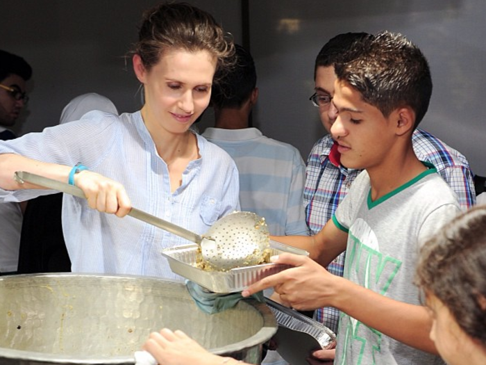 Asma al-Assad filling children