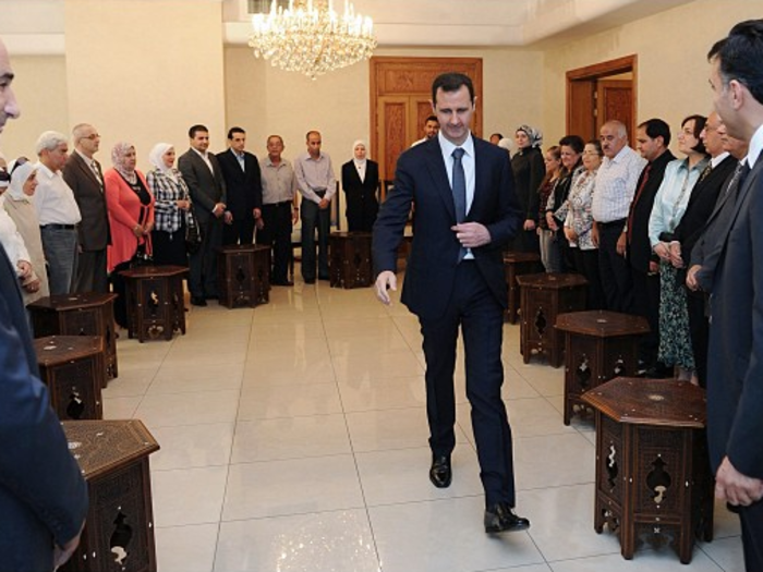 Assad graciously thanking professors.