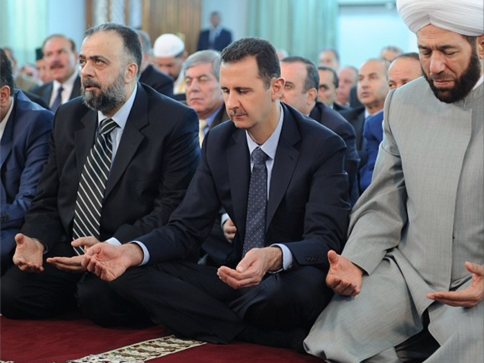 Assad piously praying with his neighbors in Damascus