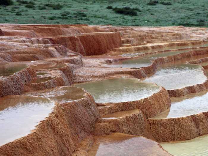 Northern Iran is home to a naturally formed staircase known as Badab-e Surt. Two mineral hot springs deposited carbonate minerals on the mountain over thousands of years, leaving behind pools of water and naturally-formed steps.