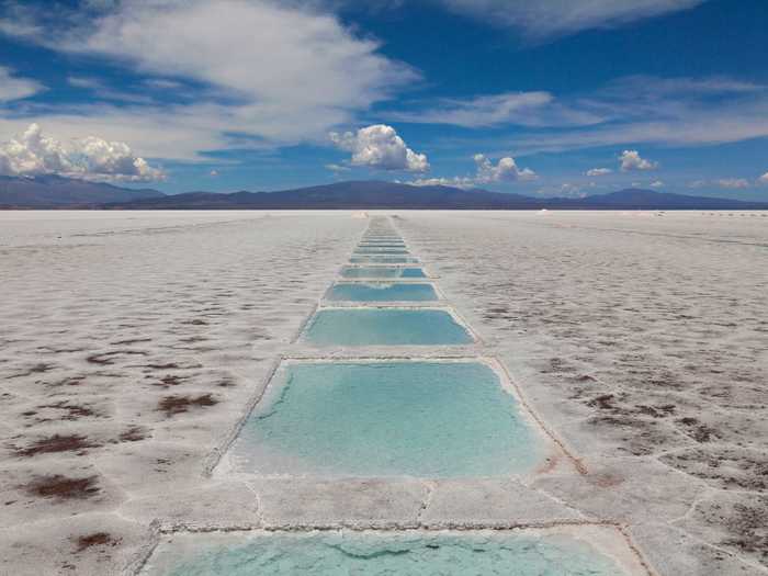 Las Salinas Grandes is a massive salt desert in Argentina. The 2,300-square-mile field is filled with pools of water created by mining companies that harvest salt there.