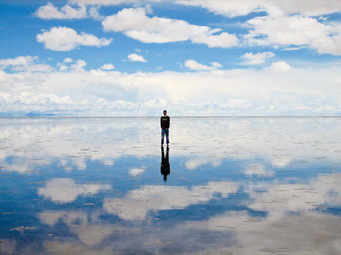 During the wet season, the Salar de Uyuni salt flats in Bolivia are covered in a thin layer of water, creating surreal reflections of the sky.