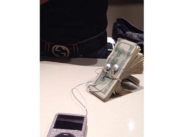 5. He wrapped his iPod earphones around a stack of money and posted it with the caption, "Money is music to my ears."