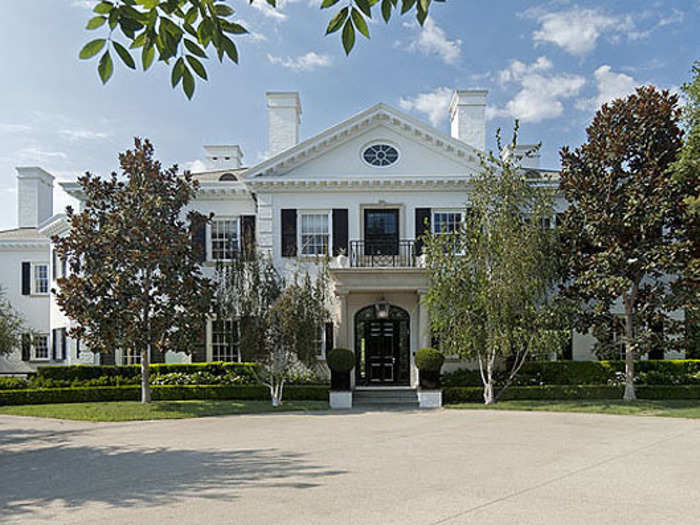 The white brick home was built in 2006, and sits on a gated 1.1 acres of land.