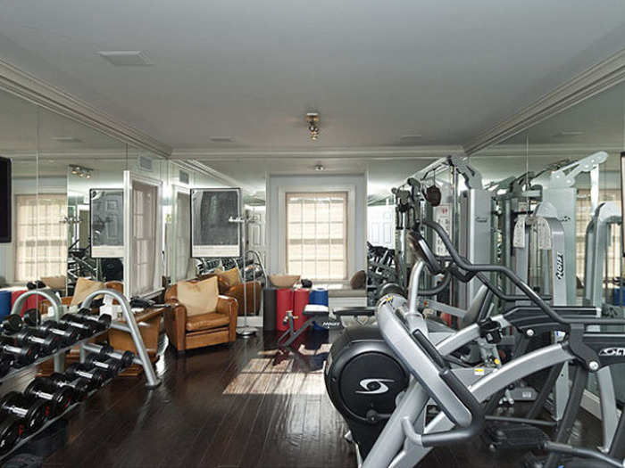 The home also has space enough for a large gym with mirrored walls and TVs...