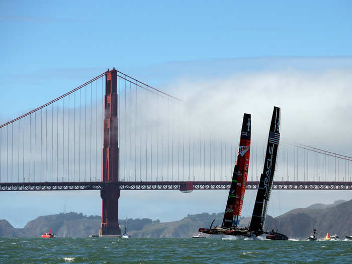 The teams race past the Golden Gate Bridge during Race 14.