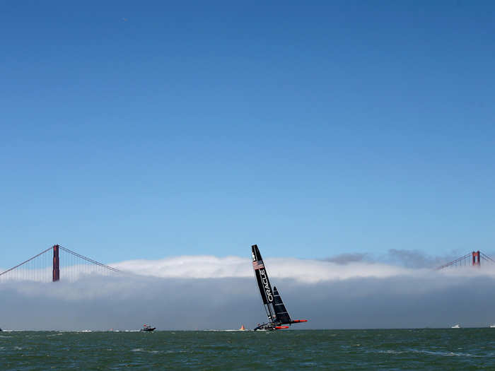 Oracle Team USA warms up outside of the fog zone.