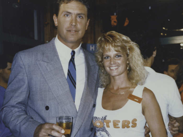 Dan Marino with a Hooters girl.