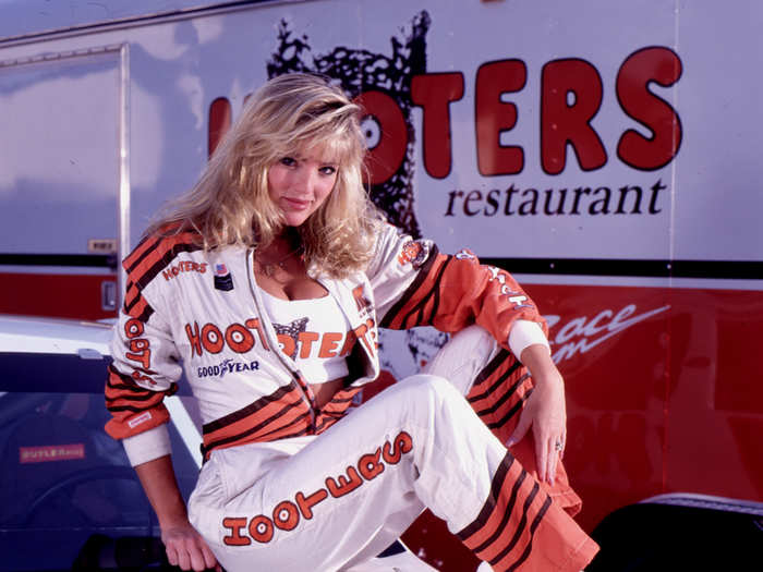 This Hooters girl is suited up for a race.