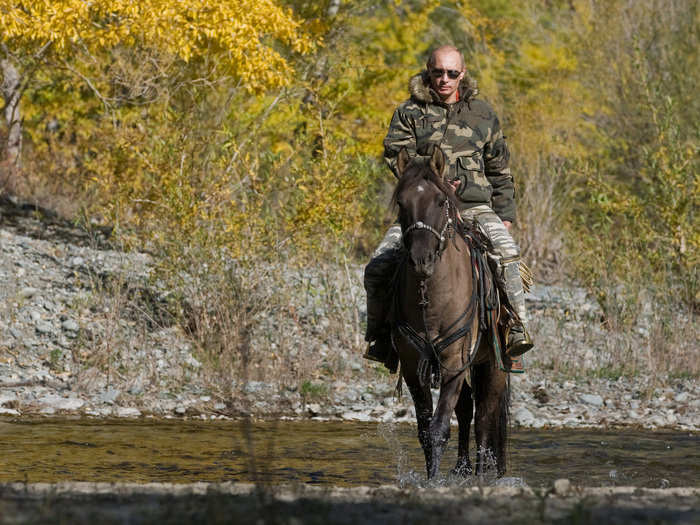 Here he rides a horse through a river in the Tyva Republic in the Siberian Federal District.