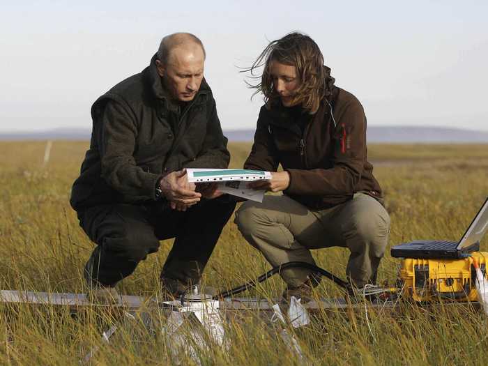 Here Putin hikes beyond the Arctic Circle to meet with scientists measuring the impacts of global climate change.