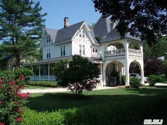 Drive your carriage right up to the front door of this historic Victorian.