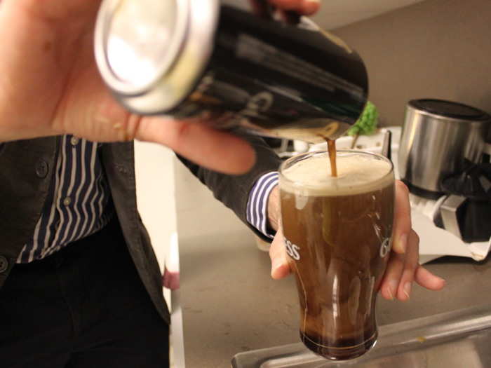 Stop pouring when the beer is near the top, and set the glass down. If you