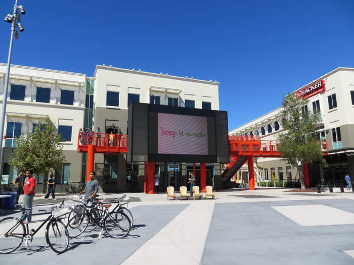 This is the main plaza. The giant screen flashes various mottos. Look down at the ground ...