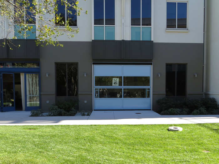 The buildings even have garages with real garage doors. The garages host temporary offices for group hacking projects.