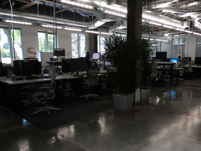 With cement floors and exposed florescent lighting, some offices have an industrial feel.