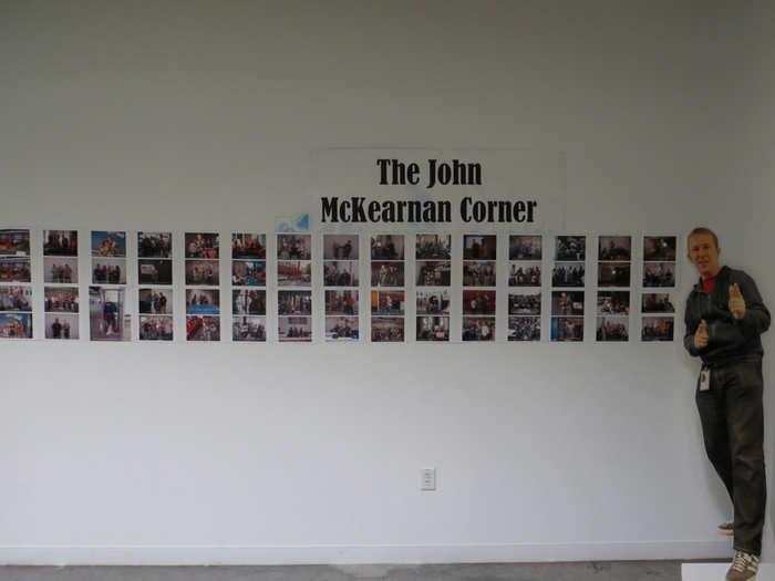 Sometimes, employees use the wall to post photos, too. This is a private joke about an employee named John McKearnan.