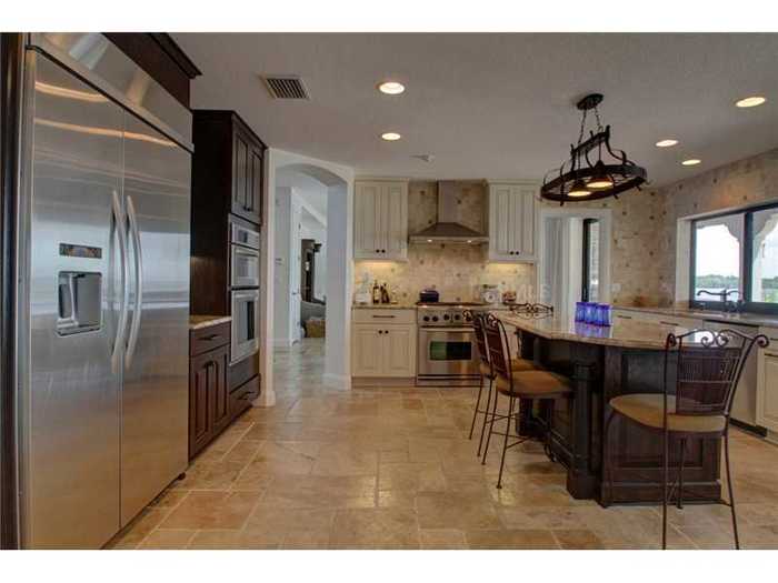 Here is the kitchen with a fridge bigger than many closets.