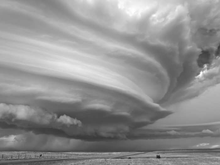 Hill gets Dobrowner to the right locations to photograph the storm, analyzes the radar, determines the stability of the atmosphere, and arranges an exit strategy.