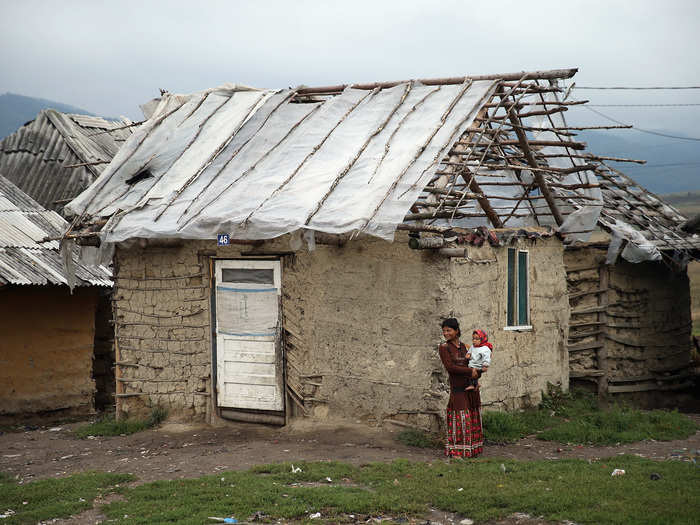 Most Roma live in huts clustered together or at encampments filled with car trailers.