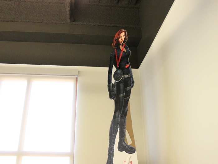 ScarJo from the Avengers as a cardboard cutout looking over the Netflix office.